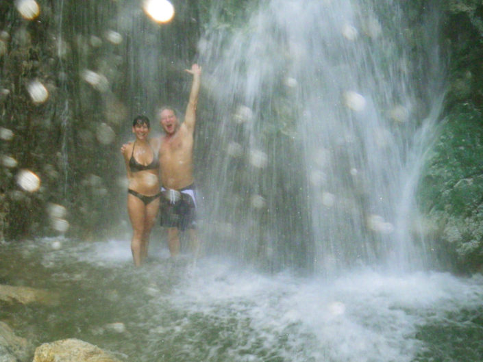 couple under waterfall
