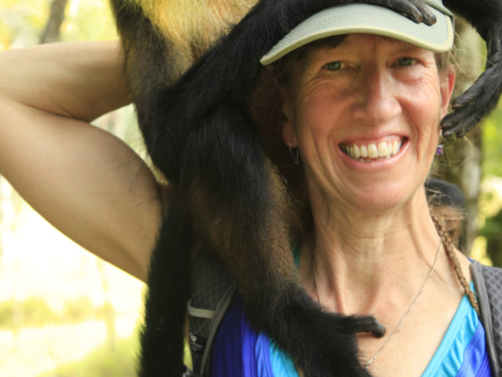 woman w a monkey on her shoulder